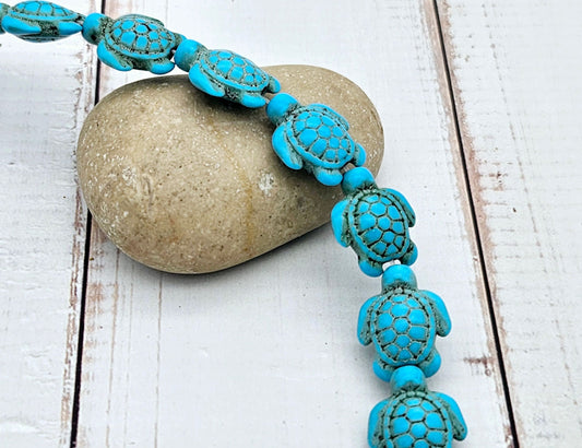 23 perles tortue en turquoise synthétique