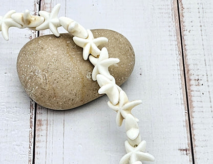 36 perles étoile de mer blanches 14mm
