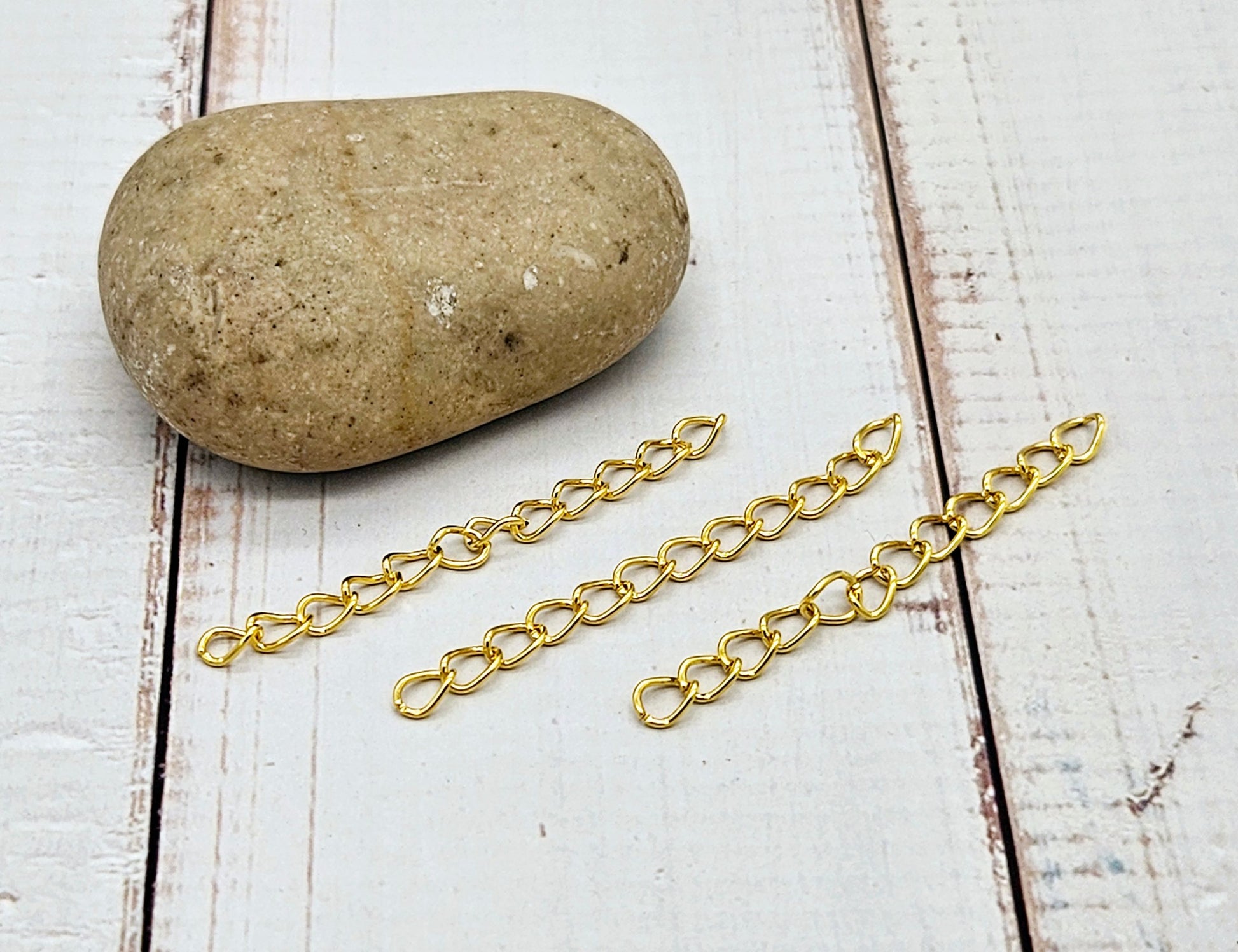 100 chaînettes d'extension maille courbée couleur or