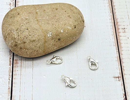 20 fermoirs mousquetons 10x5mm argent clair