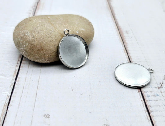 10 pendentifs plateau cabochon 18mm en acier inoxydable