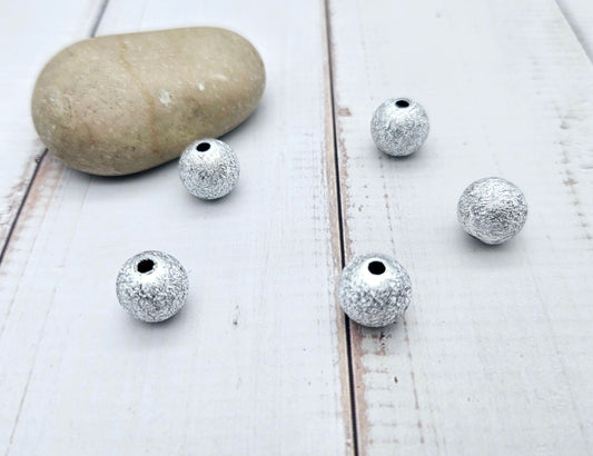 50 perles stardust argentées 12mm