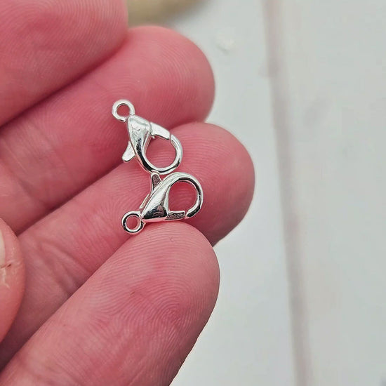 20 fermoirs mousquetons 10x5mm argent clair