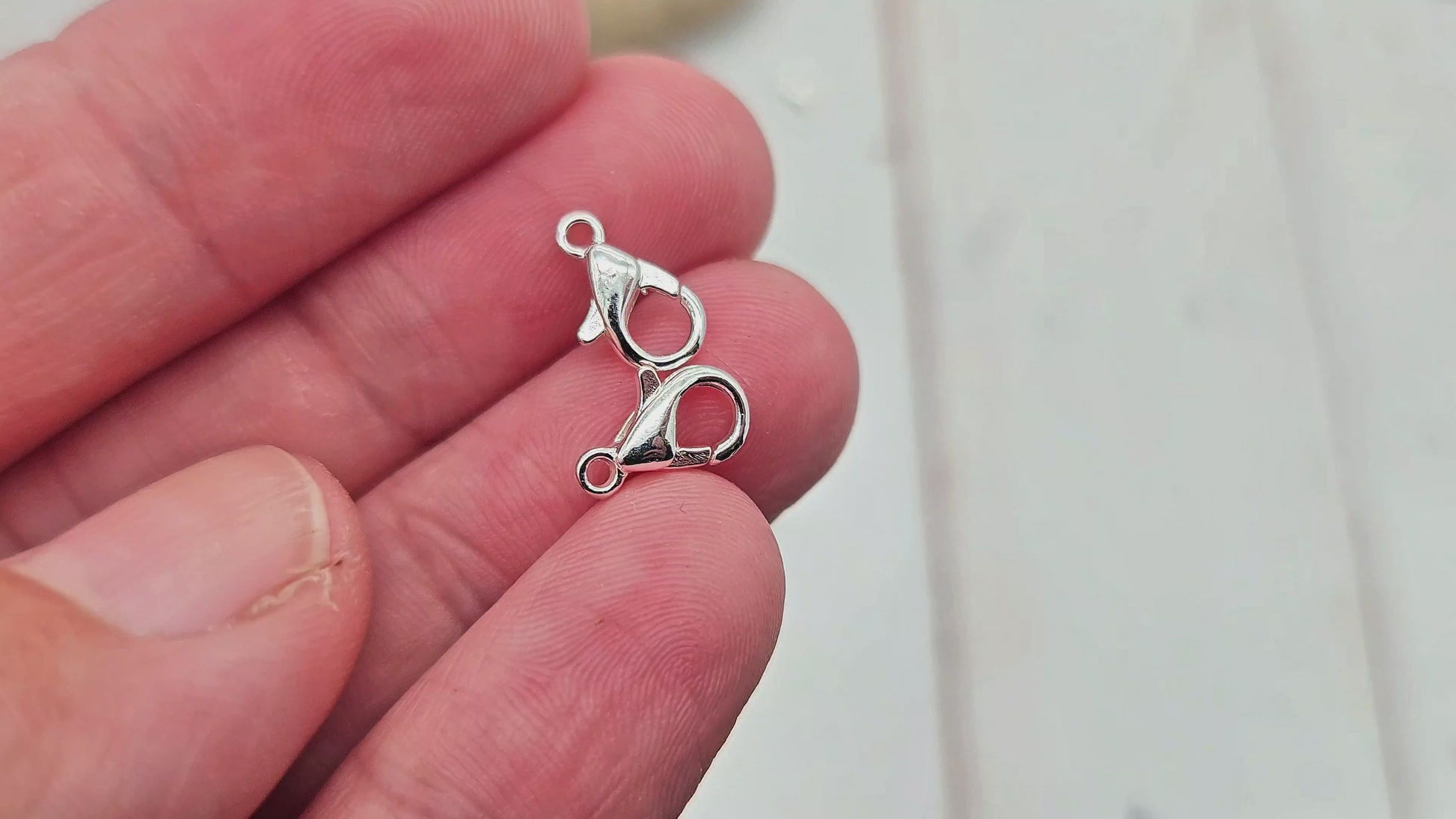 20 fermoirs mousquetons 10x5mm argent clair