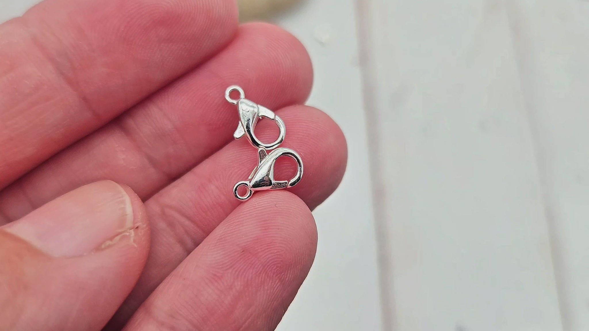 20 fermoirs mousquetons 10x5mm argent clair